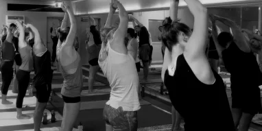 Student practicing Vinyasa Flow at yogafusion yoga Adelaide studio – explore hot, warm and yin yoga styles to build strength and calm the mind